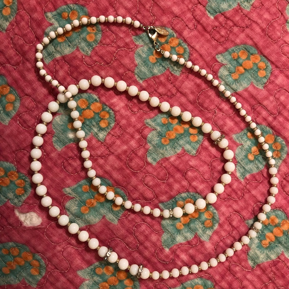 Long white bead and faux crystal necklace